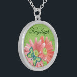 Personalised Gerber Daisy Silver Plated Necklace<br><div class="desc">Beautiful necklace with a modern green background with swirls,  pale coral orange Gerber Daisies and a pretty patterned blue green butterfly with space above the flowers to personalise with the name of your choice. Great gift for Mother's Day,  birthday,  for your bridal party and more!</div>