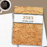 Personalised Gold 2023 Planner<br><div class="desc">This elegant Planner is decorated with a textured effect print in faux gold.
Customise it by changing the name and the year.</div>