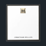 Personalised Gold Monogram Black White Notepad<br><div class="desc">Elevate your stationery game with this monogrammed notepad featuring classic block typography and a brushed gold medallion monogram and black trim. The notepad includes space for your name or custom text, making it perfect for personal or professional use. Use it to jot down notes, ideas, and reminders in style. It...</div>
