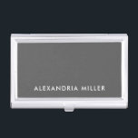 Personalised Grey Minimalist Business Card Holder<br><div class="desc">Keep your business cards organised and stylish with this personalised grey minimalist business card case. The design features your name in white sans serif font on a sleek grey background. This durable case is perfect for networking events,  conferences,  and everyday use.</div>