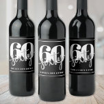 Personalised Modern Black 60th Birthday Party Wine Label<br><div class="desc">Introducing a simple and modern 60th birthday wine bottle label, perfect for celebrating this milestone in style. The design features a bold black background with a prominent "60" and "Sixty" displayed in the centre as the main focal point. Just underneath, the birthday person’s name and age are showcased again for...</div>