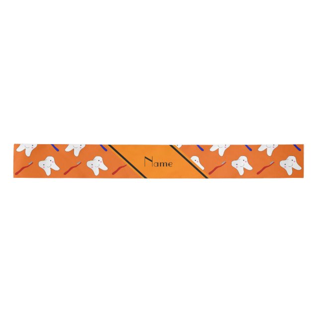 Personalised name orange brushes and tooth pattern satin ribbon (Front)