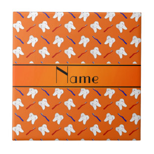 Personalised name orange brushes and tooth pattern tile