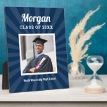 Personalised Navy Class of 2025 Graduation Photo Plaque<br><div class="desc">Modern and minimal plaque display sign with easel for the graduation party will showcase your graduate! Design features a square photo of the grad framed in white with simple and classic first name, class year, and school name wording that can be personalised. Includes a subtle starburst pattern. Navy blue background...</div>
