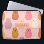 Personalised Pastel Cute Capybara Pattern  Laptop Sleeve<br><div class="desc">Introducing a capybara collection designed to infuse daily routines with warmth and positivity. Vibrant capybaras in a palette of brown, cream, yellow, purple, and pink sit against a soft pastel pink backdrop, delivering visual appeal that’s both contemporary and approachable. Prominently, your name appears in a crisp, modern font, offering a...</div>