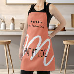 Personalised Pink Black Modern Script Monogram Apron<br><div class="desc">Elevate your cooking experience with our Personalised Pink Monogram Apron, featuring a chic modern script that adds a touch of elegance to your kitchen attire. This stylish apron is perfect for chefs of all levels who appreciate both function and fashion. Crafted from high-quality materials, it ensures durability and comfort, making...</div>