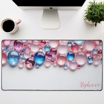 Personalised Pink & Blue Gemstone Desk Mat<br><div class="desc">Elevate your workspace with this personalised desk mat adorned with a captivating arrangement of pink and blue gemstones. The vibrant colours and natural textures create a mesmerising and inspiring backdrop for your work. Make it truly yours by adding your name or a motivational quote. The smooth surface provides a comfortable...</div>