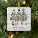 Personalised Rustic Christmas Trees Wood Holiday   Ceramic Ornament<br><div class="desc">Rustic Christmas trees and string lights ornament on a wood background with your family name,  for your holiday season. Earthy rustic country homey style. Merry Christmas with family name. Elegant metal ornament.</div>