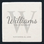 Personalised Script Groomsmen's name and Monogram Stone Coaster<br><div class="desc">Add a personal touch to your wedding with personalised groomsmen stone coaster. This coaster features personalised groomsman's name in grey classic script font style with wedding details in grey classic serif font style and monogram in light grey classic serif font style as background, on white background. Also perfect for best...</div>