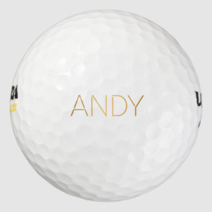 Personalised Stencil Font Andy Gold on Black Golf Balls