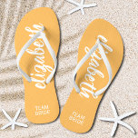 Personalised Team Bride Orange and White<br><div class="desc">Light orange and white - or any colour - flip flops personalised with your name and "Team Bride" or any wording you choose. Great bridesmaid gift, bachelorette party, flat shoes for the wedding reception, or a fun bridal shower favour. Change the colour straps and footbed, too! More colours done for...</div>