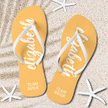 Personalised Team Bride Orange and White Jandals<br><div class="desc">Light orange and white - or any colour - flip flops personalised with your name and "Team Bride" or any wording you choose. Great bridesmaid gift, bachelorette party, flat shoes for the wedding reception, or a fun bridal shower favour. Change the colour straps and footbed, too! More colours done for...</div>