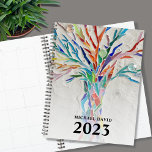 Personalised Tree of Life  2023 Planner<br><div class="desc">This unique Planner is decorated with a brightly coloured Tree of Life on a pale grey background. The original design was made in mosaic using tiny pieces of brightly coloured glass. Customise it with your name and year. To edit further use the Design Tool to change the font, font size,...</div>
