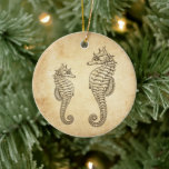 Personalised Vintage Seahorses Ocean Beach Ceramic Tree Decoration<br><div class="desc">This beach themed Christmas tree ornament features vintage images of a mum and baby seahorse.  They are set against a vintage style paper background.  It can be personalised with a name and year or any text that you wish to add.  
Some graphics by Origins Digital Curio at www.etsy.com/shop/OriginsDigitalCurio</div>