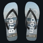 Personalised Wedding Beach Sand Jandals<br><div class="desc">Pretty Blue Sky with Light Fluffy White Clouds, Blue Sea, Crashing Ocean Waves and Beach Sand. Unisex Flip Flops with Bride and Groom Date of Marriage written in a white colour text. PERSONALIZE with your text on left and right feet, (or delete text to only show image). The wedding date...</div>