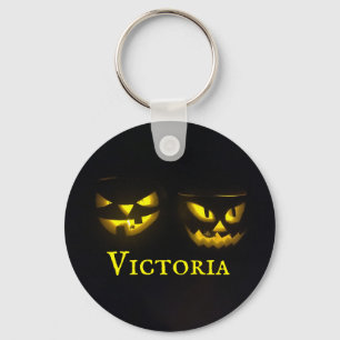 Personalised yellow on black creepy pumpkins round key ring