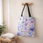 Personalized Purple Floral Name Tote Bag<br><div class="desc">Looking for a thoughtful and practical personalized gift? This Purple Floral Name Tote Bag is a beautiful everyday accessory designed to feel both meaningful and useful. Featuring a soft purple floral design with a custom name, this tote instantly becomes a personal keepsake. Simply add the name and preview exactly how...</div>