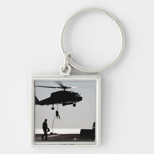 Personnel fast-rope out of an SH-60F Key Ring (Front)