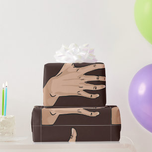 Persons Hand Wrapping Paper