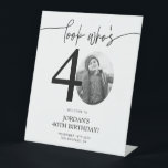 Photo 40th Birthday Welcome Sign | Look Who's 40<br><div class="desc">Welcome guests to your 40th birthday celebration with this stunning editable welcome sign. Featuring a sleek, customizable layout, this template allows you to easily add your own photo and personalize the text, making it a perfect addition to your milestone 40th birthday decor. Ideal for entryways or as a party focal...</div>