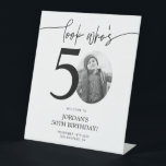 Photo 50th Birthday Welcome Sign | Look Who's 50<br><div class="desc">Welcome guests to your 50th birthday celebration with this stunning editable welcome sign. Featuring a sleek, customizable layout, this template allows you to easily add your own photo and personalize the text, making it a perfect addition to your milestone 50th birthday decor. Ideal for entryways or as a party focal...</div>