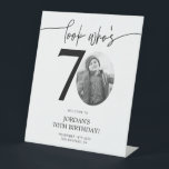 Photo 70th Birthday Welcome Sign | Look Who's 70<br><div class="desc">Welcome guests to your 70th birthday celebration with this stunning editable welcome sign. Featuring a sleek, customizable layout, this template allows you to easily add your own photo and personalize the text, making it a perfect addition to your milestone 70th birthday decor. Ideal for entryways or as a party focal...</div>