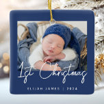 Photo Baby's First Christmas Navy Blue White Ceramic Ornament<br><div class="desc">Celebrate baby's first Christmas with this modern minimalist photo keepsake ornament. The navy blue text reads "1st Christmas" in trendy handwriting script. Easily replace the sample image with your favourite photo,  and add baby's name and the year below. A white gradient screen helps make the text overlay pop.</div>