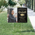 Photo Congratulations Black & Gold Graduation Yard Garden Sign<br><div class="desc">Add a personalized touch to college or high school graduation party decorations with this custom photo black and gold yard sign. Simply place in lawn to welcome guests. Design features a gold foil look mortar board, stylish modern typography, handwritten style script calligraphy, and a picture of the graduate, such as...</div>