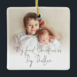 Photo Name Year First Christmas Big Brother Cerami Ceramic Ornament<br><div class="desc">Photo Overlay Names Year First Christmas As Big Brother. To celebrate your new baby and older brother, with an elegant set script for First Christmas. Choose your favourite photo to replace the sample picture. Changes to colours of text can be made to better suit your photo if necessary via the...</div>