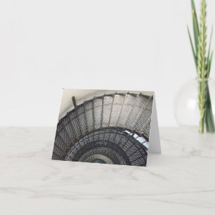 Photo of a black metal stair case inside a tower card