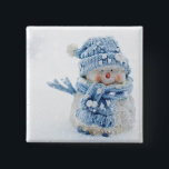 Photo of a Cute Snowman in Winter - Christmas 15 Cm Square Badge<br><div class="desc">Button with a cute photograph of a little snowman. Standing outside in the winter with snow falling all around. This cute little guy is dressed up in blue knitted hat and scarf.</div>