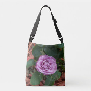 Photo of a lavender coloured rose on a crossbody bag