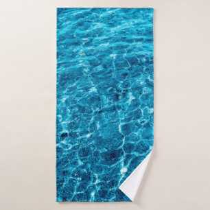 Photo of a macro bubbling blue clear sea water bath towel