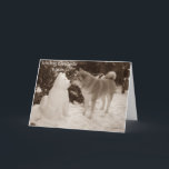 photo of cute akita kissing snowman snow dog holiday card<br><div class="desc">The funny snow akita snowman on this customizable christmas card was built just after Christmas in the thick December snow. The snow akita has a funny expression on his face, but… I think anyone would look like he does if they’d been sitting in the cold snow for hours. The pretty...</div>