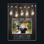 Photo Rustic Country Mason Jar Save The Date Cards<br><div class="desc">Photo Rustic Country Mason Jar Save The Date Cards - features a printed barn wood or reclaimed wood background with glowing mason jars at the top. Mason jars glowing can be interpreted as having a firefly design or just twinkle lights inside. Mason Jars dangle from twinkle string lights. You may...</div>