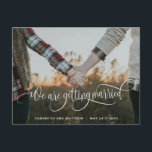 Photo, We Are Getting Married White Calligraphy Announcement Postcard<br><div class="desc">Getting married? Congratulations! Tell family and friends your great news with this elegant and modern horizontal photo engagement announcement postcard. "We are getting married" photo overlay in gorgeous white modern hand written calligraphy. Ability to adjust "We are getting married" text photo overlay position, to suit your image the best by...</div>