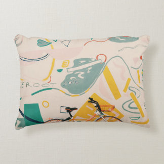 PHOTOGRAPHY OF ORANGE AND WHITE BICYCLE DECORATIVE CUSHION