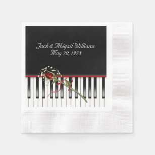 piano keyboard with red rose anniverary napkin