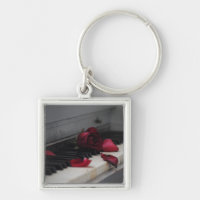 Piano Keys with a Red Rose