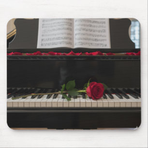 Piano with red rose and rose petals mouse pad