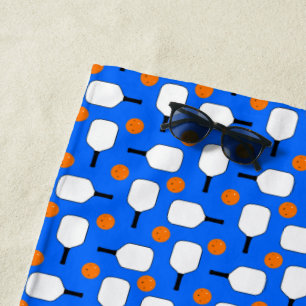 Pickleball Paddles, Orange Pickleball Balls, Blue Beach Towel