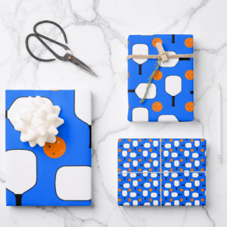 Pickleball Paddles, Orange Pickleball Balls, Blue Wrapping Paper Sheet