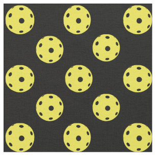 Pickleballs on black background fabric