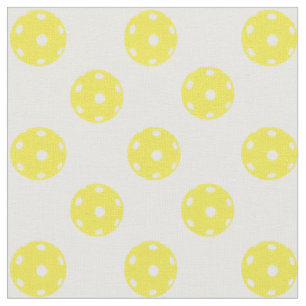 Pickleballs on white fabric