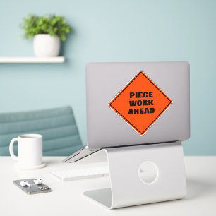 Piece work ahead diamond caution road sign