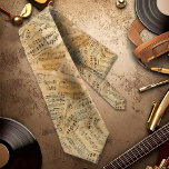 Pieces of Vintage Music ID389 Tie<br><div class="desc">Scraps of vintage sheet music,  musical notes and lyrics form this unique,  seamless pattern that is both trendy and upbeat. These make fun accessories for any music lover or musician. Search ID389 to see other products with this pattern.</div>