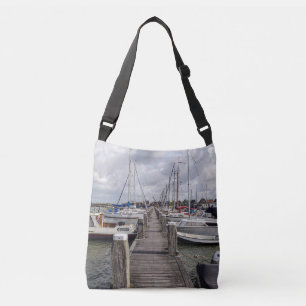 Pier with boats and yachts in Marken Netherlands Crossbody Bag