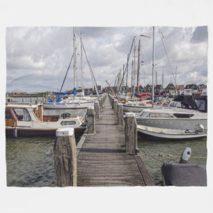 Pier with boats and yachts in Marken Netherlands Fleece Blanket
