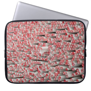 Pile of rolled papers laptop sleeve