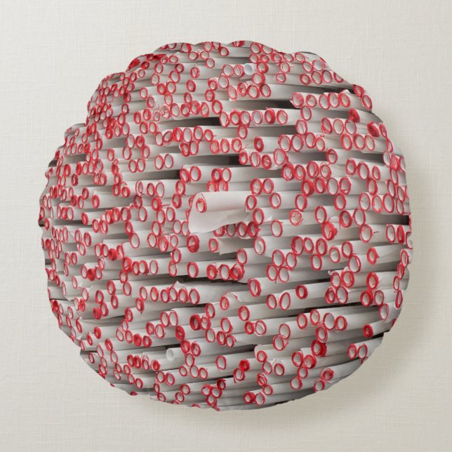 Pile of rolled papers round cushion (Front)